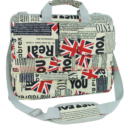 newspaper laptop hand bag